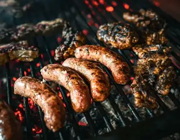 Meat cooking on a barbecue grill